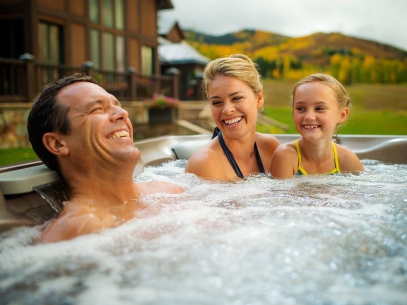 Couple relaxing in an Aspen Spa hot tub